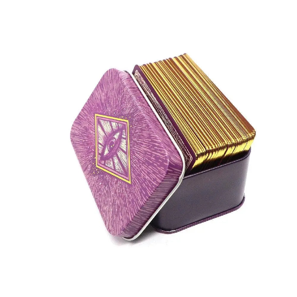 Decorative tin box with purple and gold design on a white background