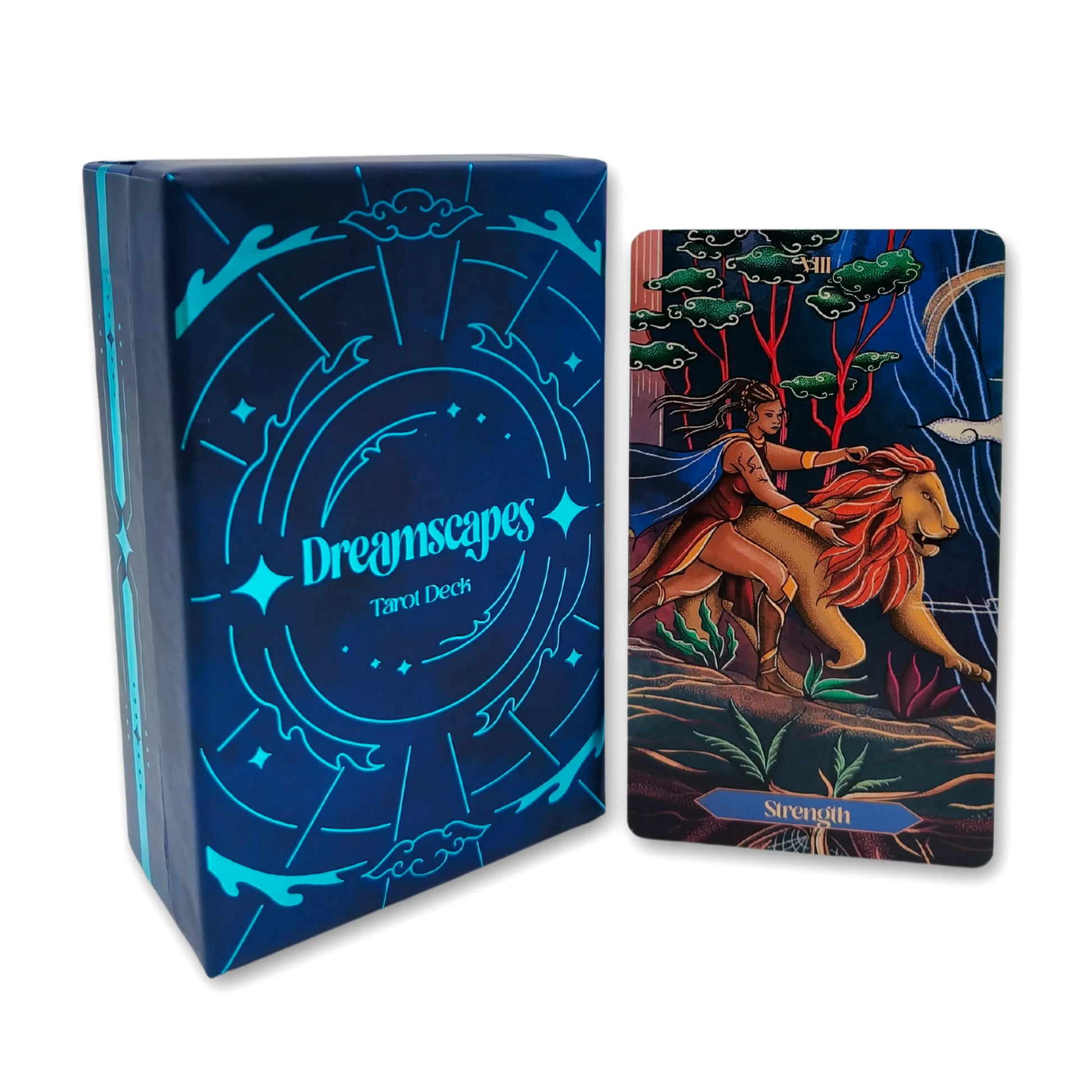 Dreamscapes Tarot Deck packaging with a tarot card featuring a woman riding a lion.