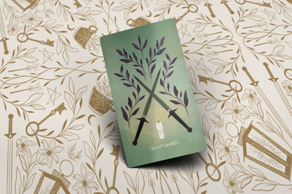 Green book with floral design on a patterned background