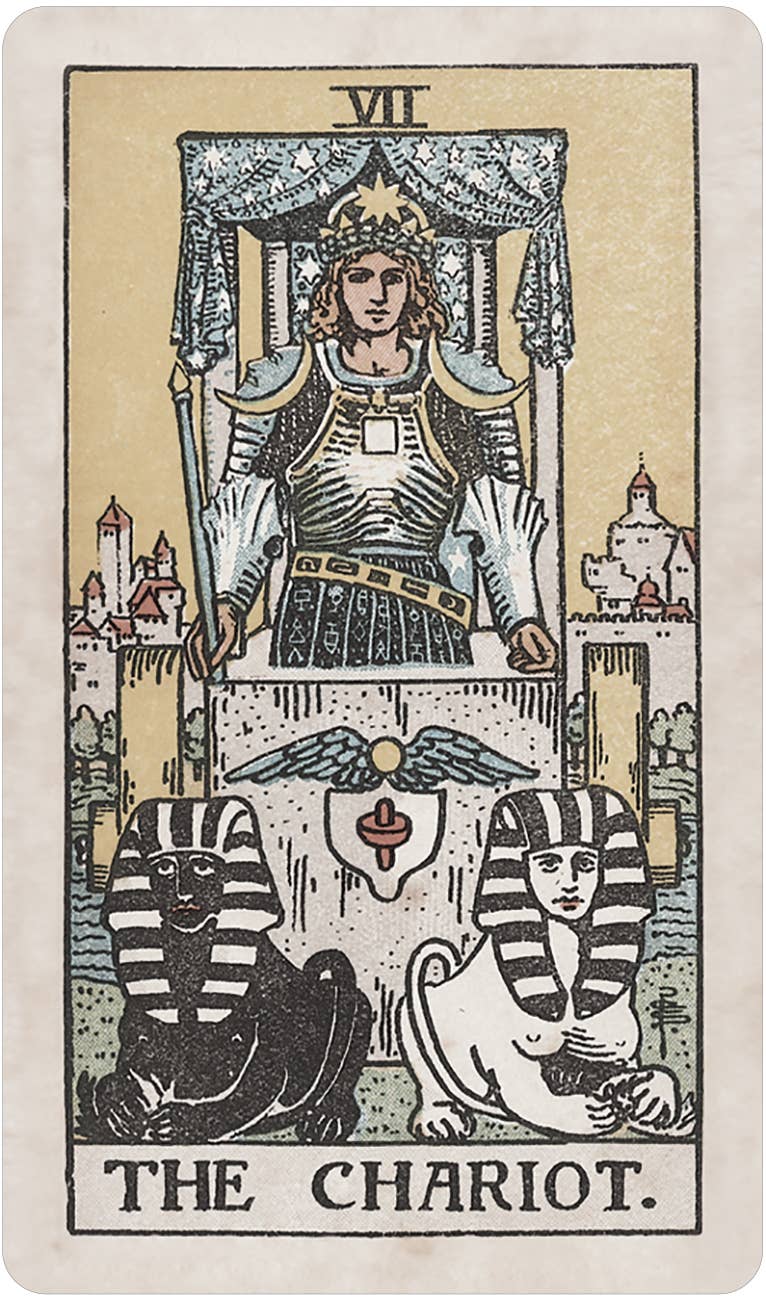 Tarot card titled 'The Chariot' with a central figure and sphinxes below, on a beige background. Pamela Colman Smith's RWS Tarot Deck Soft Color Edition by U.S. Games Systems featuring muted vintage colours, ivory borders, and the original Rider-Waite-Smith artwork.