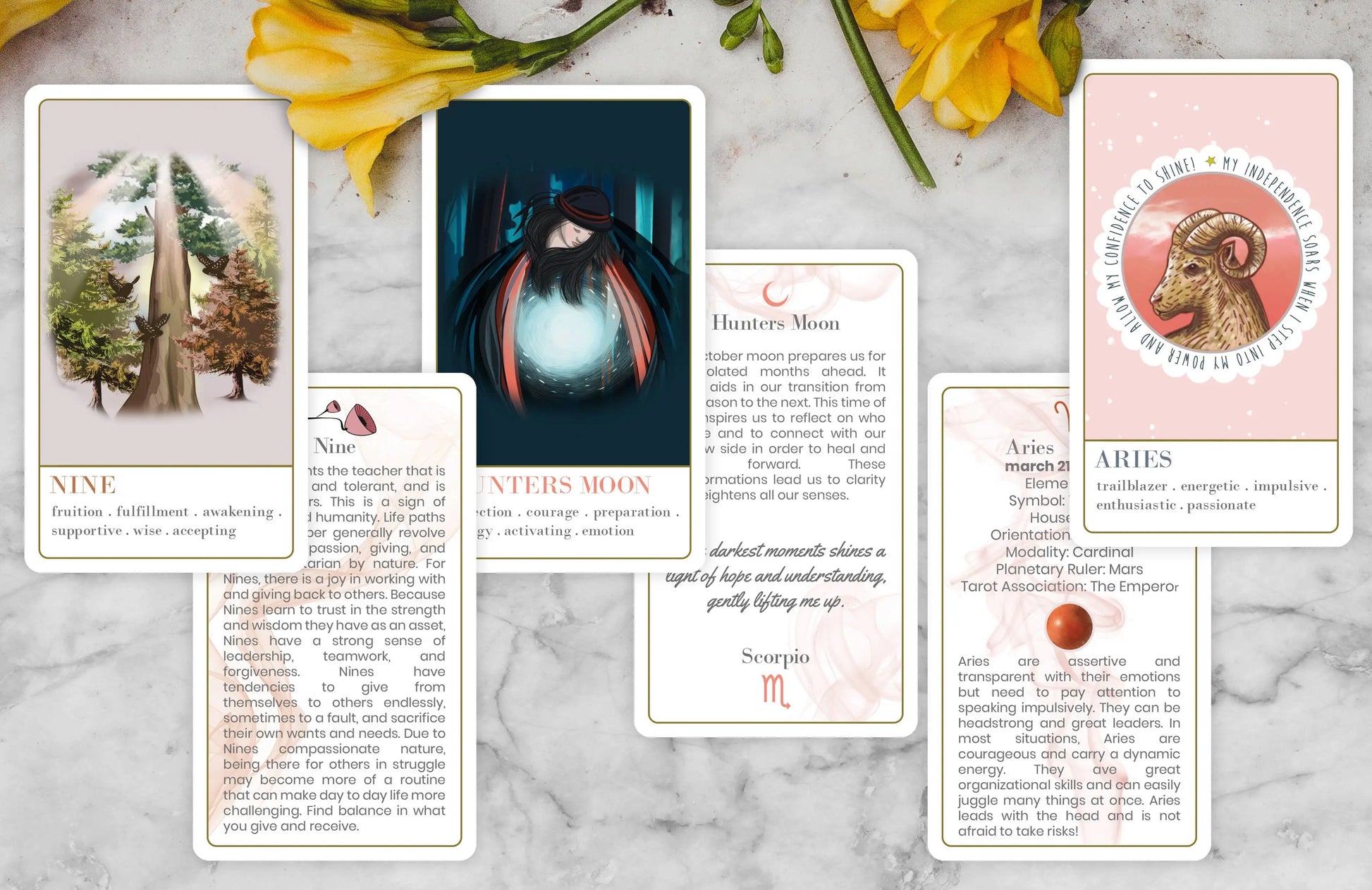 Wanderlust collection oracle deck Set of tarot cards on a marble surface with flowers