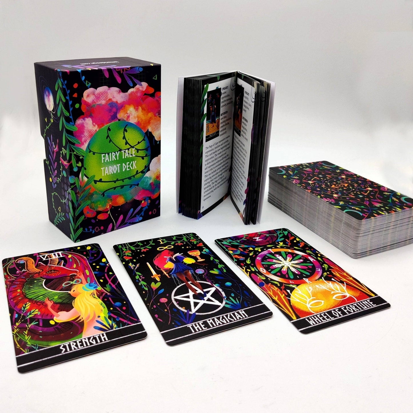Colorful tarot cards with deck box and cards displayed on a white background