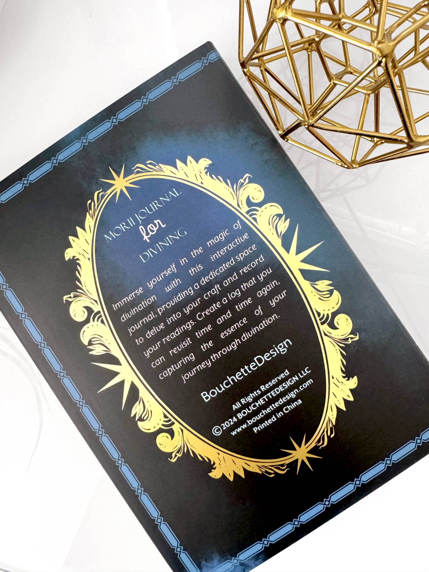 Decorative box with gold and blue design on a white background