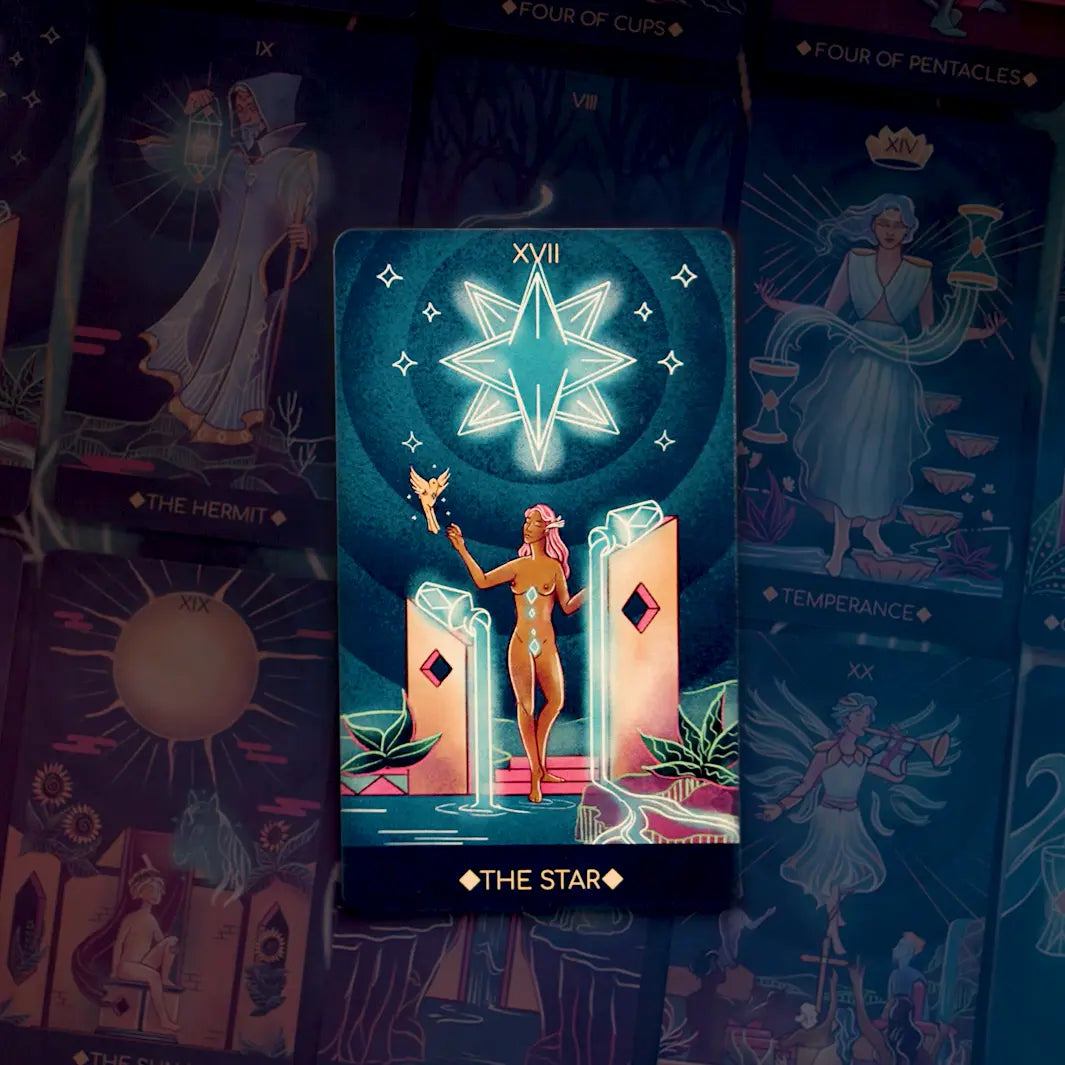 Tarot card titled 'The Star' with a person holding a star, surrounded by other tarot cards.