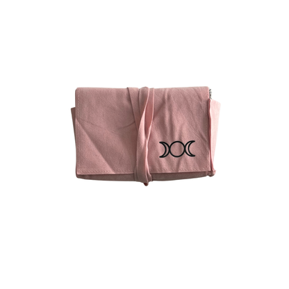 Pink tarot pouch with a black triple moon symbol on a white background
