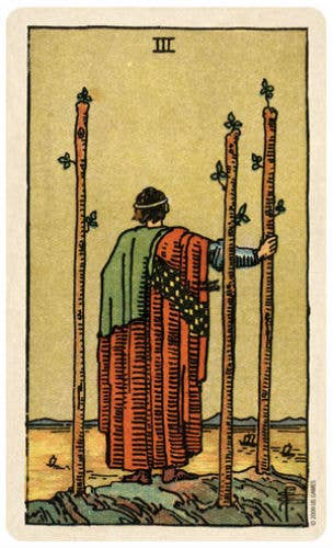 Vintage-style tarot card with a figure holding two tall sticks on a beige background