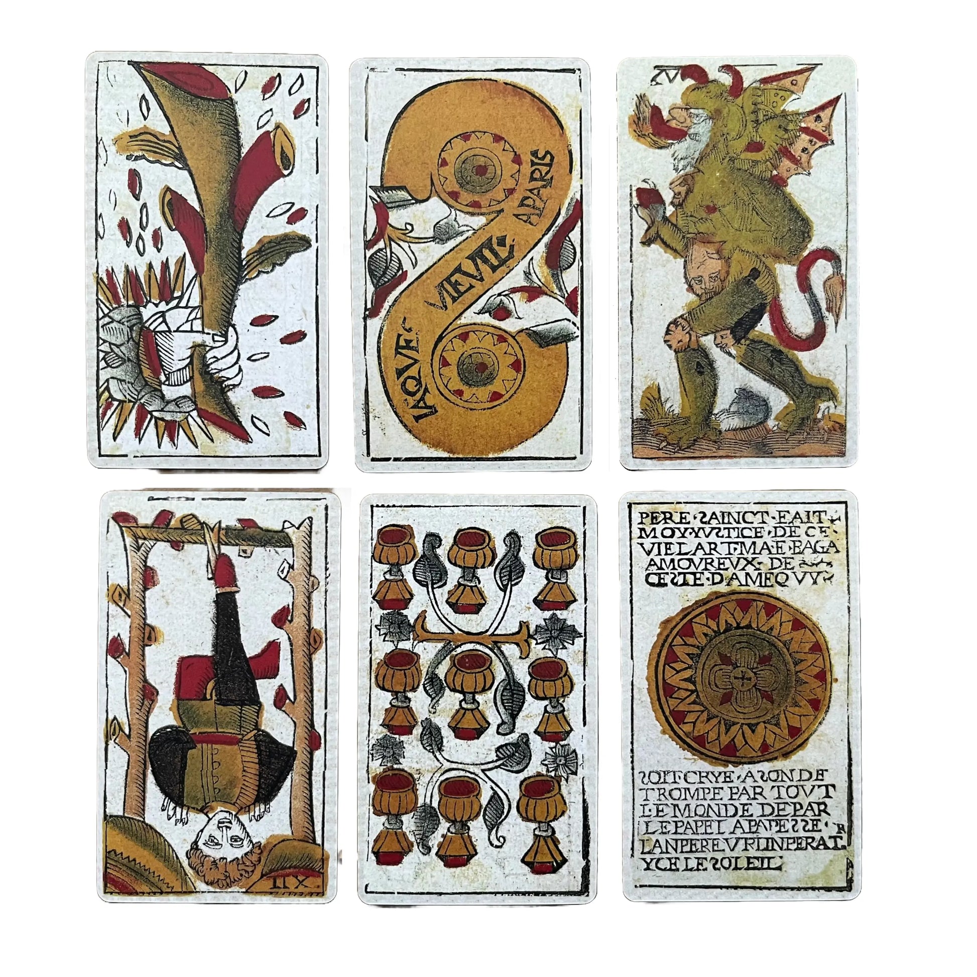 Set of six vintage playing cards with intricate designs on a white background