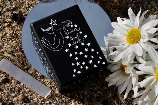 DIVINA Tarot Deck by Mary Elizabeth Evans featuring elegant monochrome pen and ink artwork with celestial symbolism and a 78-card indie tarot deck.