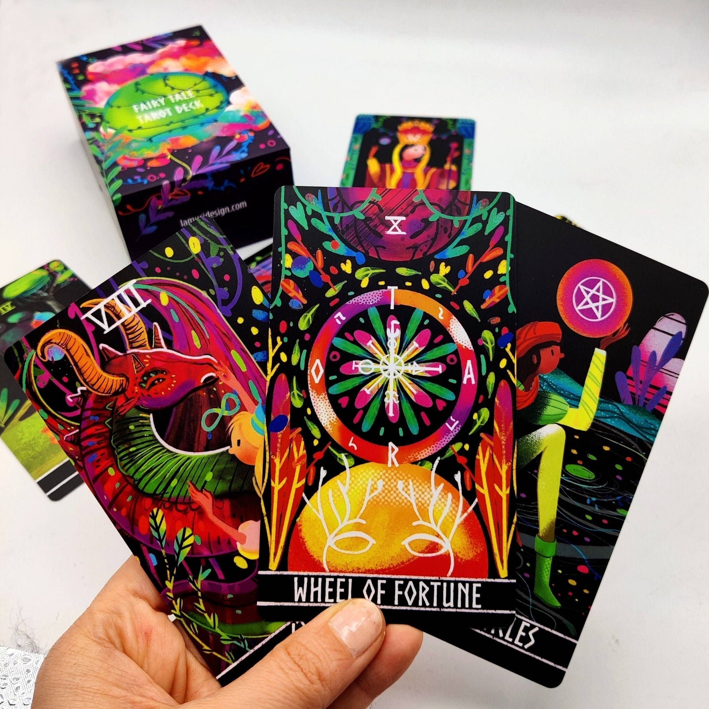 Colorful tarot cards with intricate designs on a white background