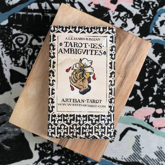 Tarot deck with wooden cover on a colorful abstract background