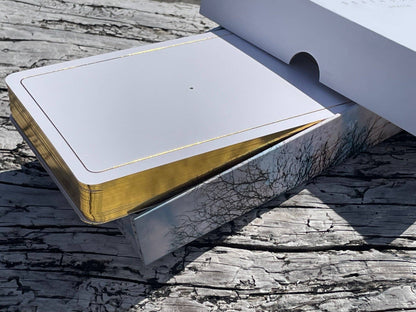 Death Doula Oracle Cards featuring original analogue 35mm photography with double exposure imagery, gold gilded edges and a guidebook for spiritual transformation and healing.