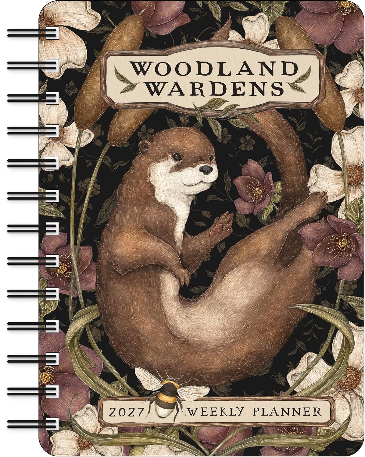 Woodland Wardens 2027 Weekly Planner with a spiral binding, featuring an illustration of an otter surrounded by flowers and leaves on a dark background.