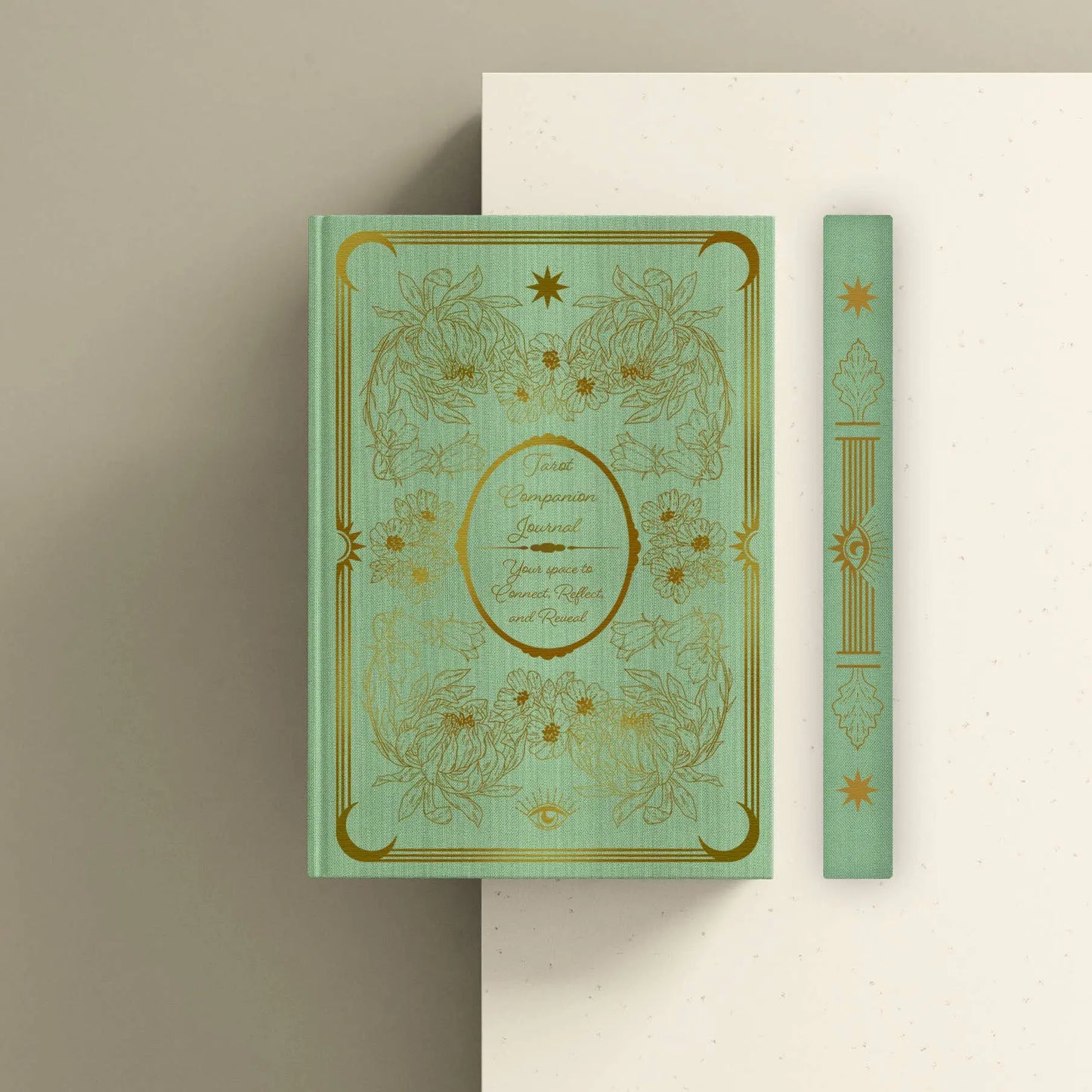 Decorative book with gold embossed design on a beige background Tarot journal Bouchette and Co Oneness Emporium