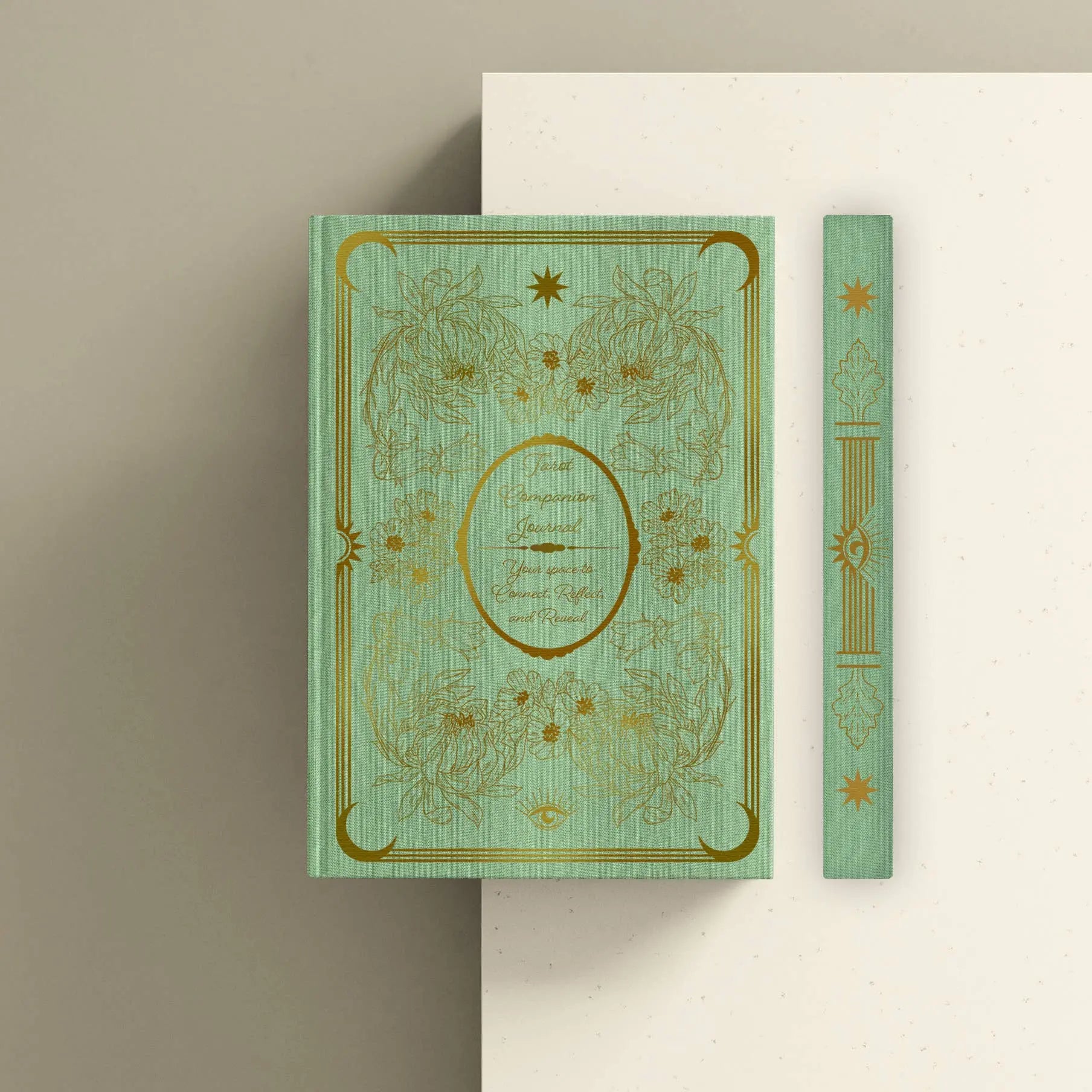 Decorative book with gold embossed design on a beige background Tarot journal Bouchette and Co Oneness Emporium