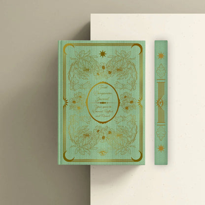 Decorative book with gold embossed design on a beige background Tarot journal Bouchette and Co Oneness Emporium