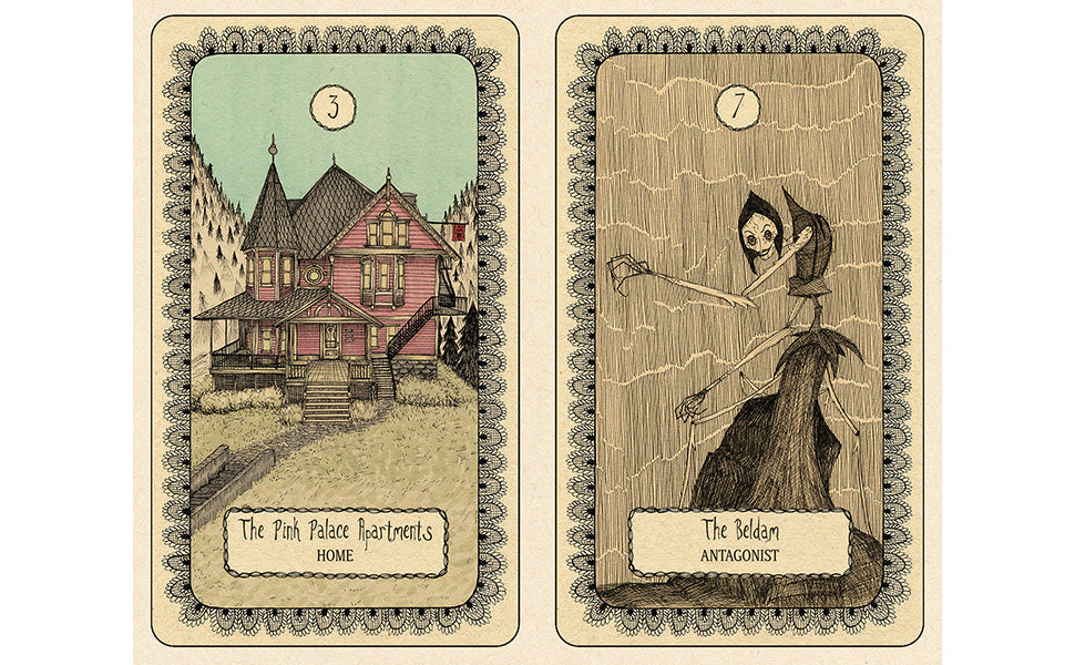 Two illustrated tarot-style cards shown side by side on a light background. The left card, labeled 'The Pink Palace Apartments Home,' shows a vintage pink house. Coraline Oracle deck 