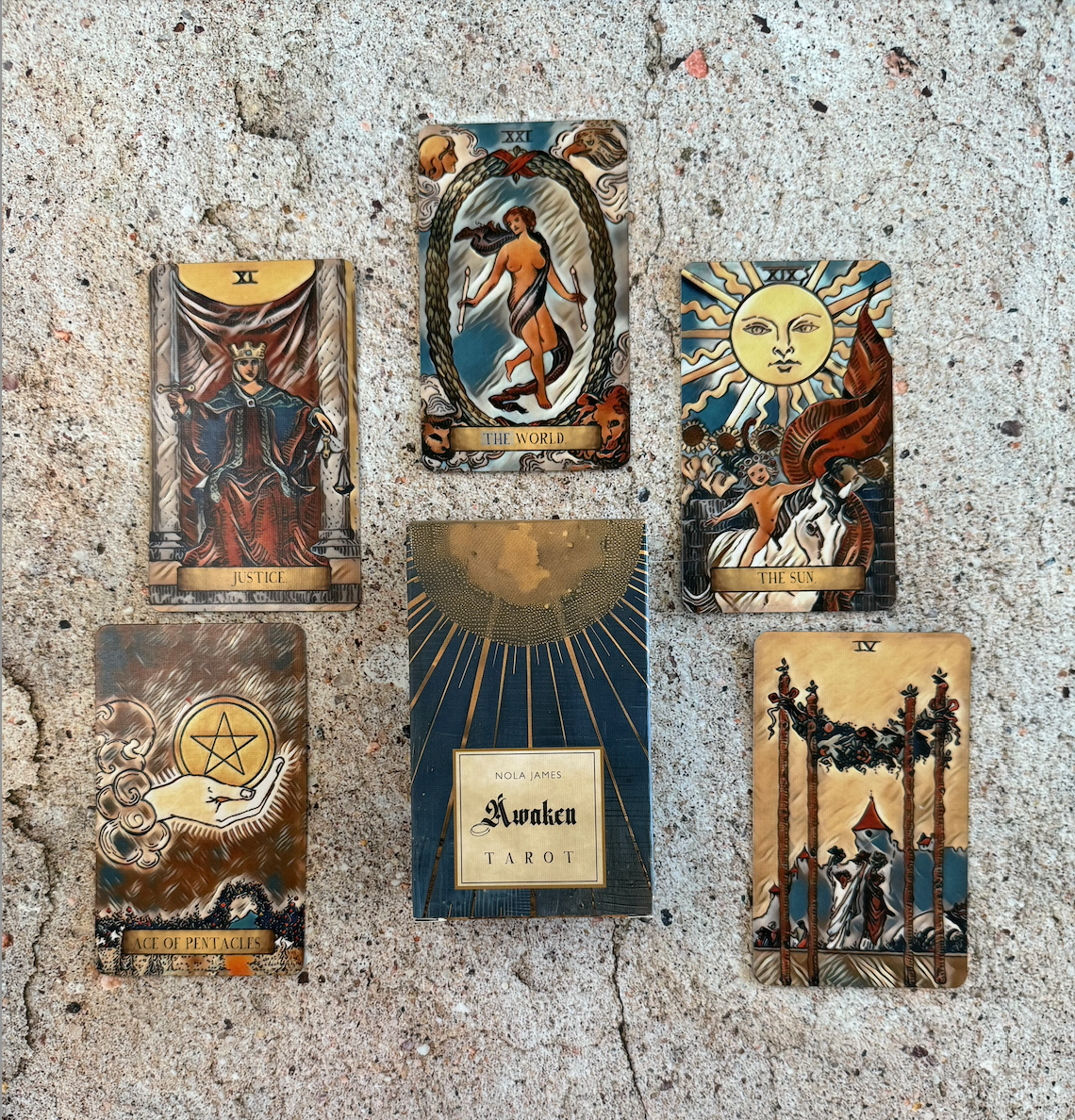 Collection of tarot cards on a textured surface