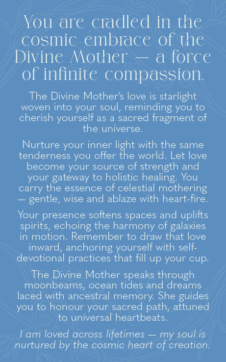 A blue square card or print with white text reading a spiritual message about Divine Mother and cosmic compassion, shown against a matching blue background.