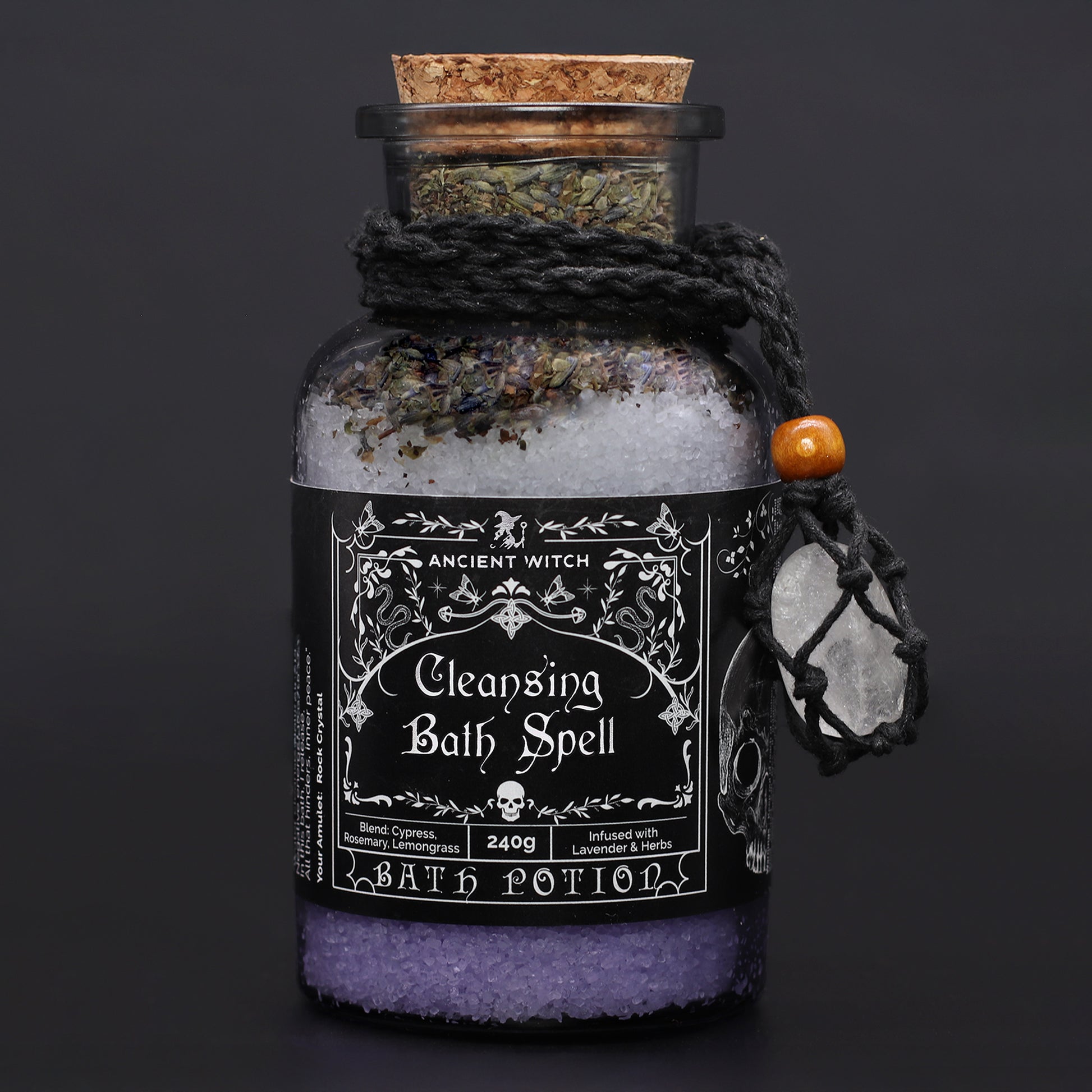 Bottle of 'Cleansing Bath Spell' bath potion with decorative label on a dark background