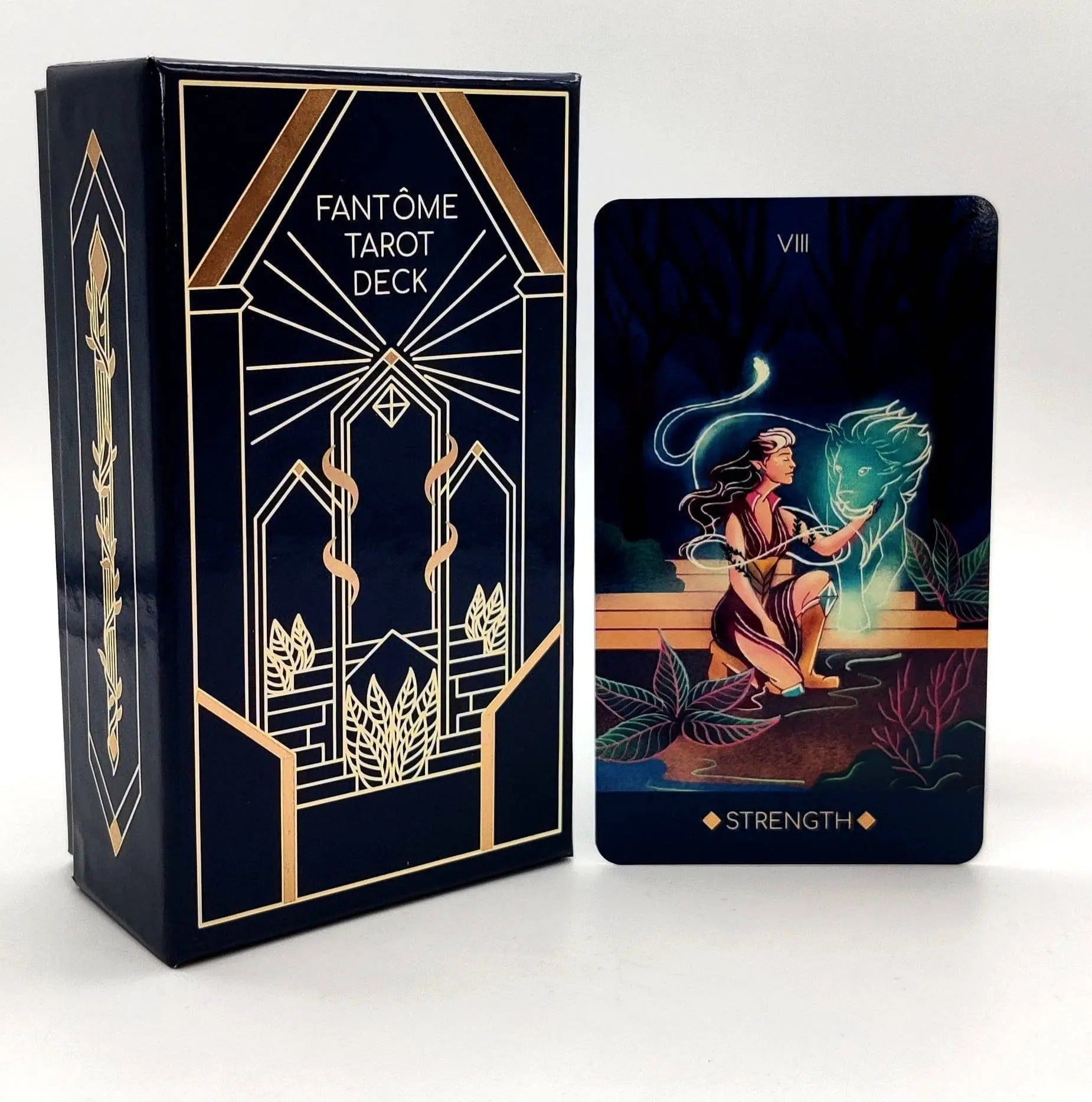 Fantome Tarot Deck packaging with a tarot card featuring the 'Strength' symbol on a white background