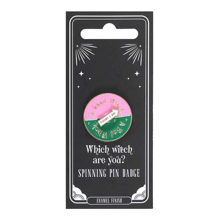 Which Witch Are You spinning enamel pin badge with pink, green and white design and interactive rotating arrow.