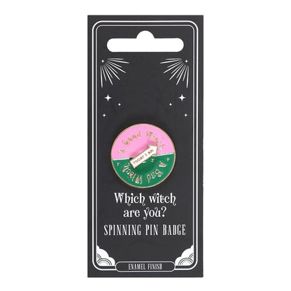 Which Witch Are You spinning enamel pin badge with pink, green and white design and interactive rotating arrow.