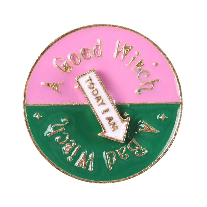 Which Witch Are You spinning enamel pin badge with pink, green and white design and interactive rotating arrow.