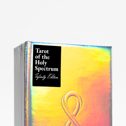 Tarot of the Holy Spectrum Infinity Edition packaging with a colorful design and black label. Tarot of the Holy Spectrum Infinity Edition Holographic Mirror by Chase Voorhees, featuring colourful tarot cards, reflective holographic backs and edges, and a mirrored magnetic box.