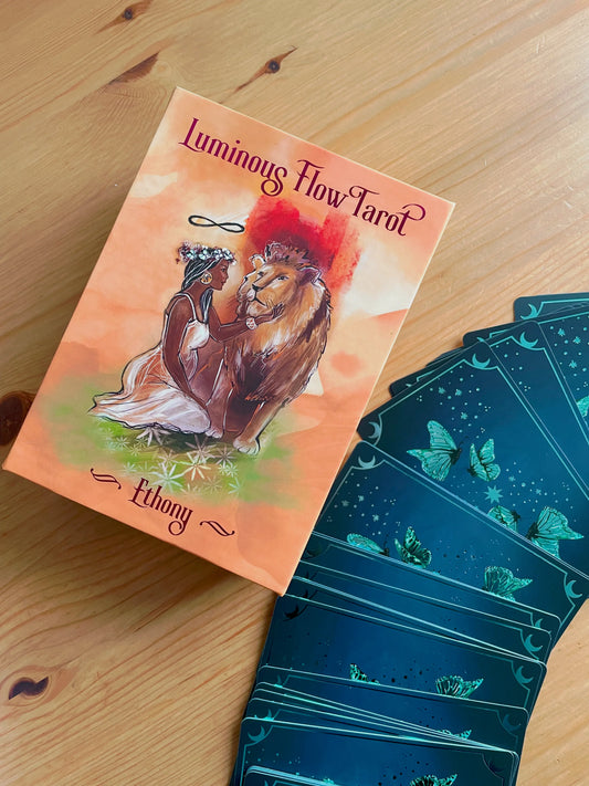 Luminous Flow Tarot first edition deck with watercolor artwork and gold detailed box.