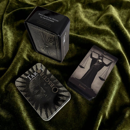 Tarot Obscuro Mini Edition indie tarot deck with black matte edges and metal storage tin.