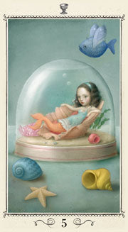 A mermaid lying in a abalone shell inside a snow globe. 5 of cups tarot card from the Nicoletta Ceccoli tarot deck from Lo scarabeo 