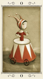 Depicts the Fool tarot card- showing a jack in the box like figure upon a red and white stand with wheels 
