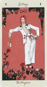 David bowie- esque dressed man in a elegant pose. Pink background with roses and lilies as a nod to Pamela Colman smith . Title in both Spanish and English The magician tarot card 