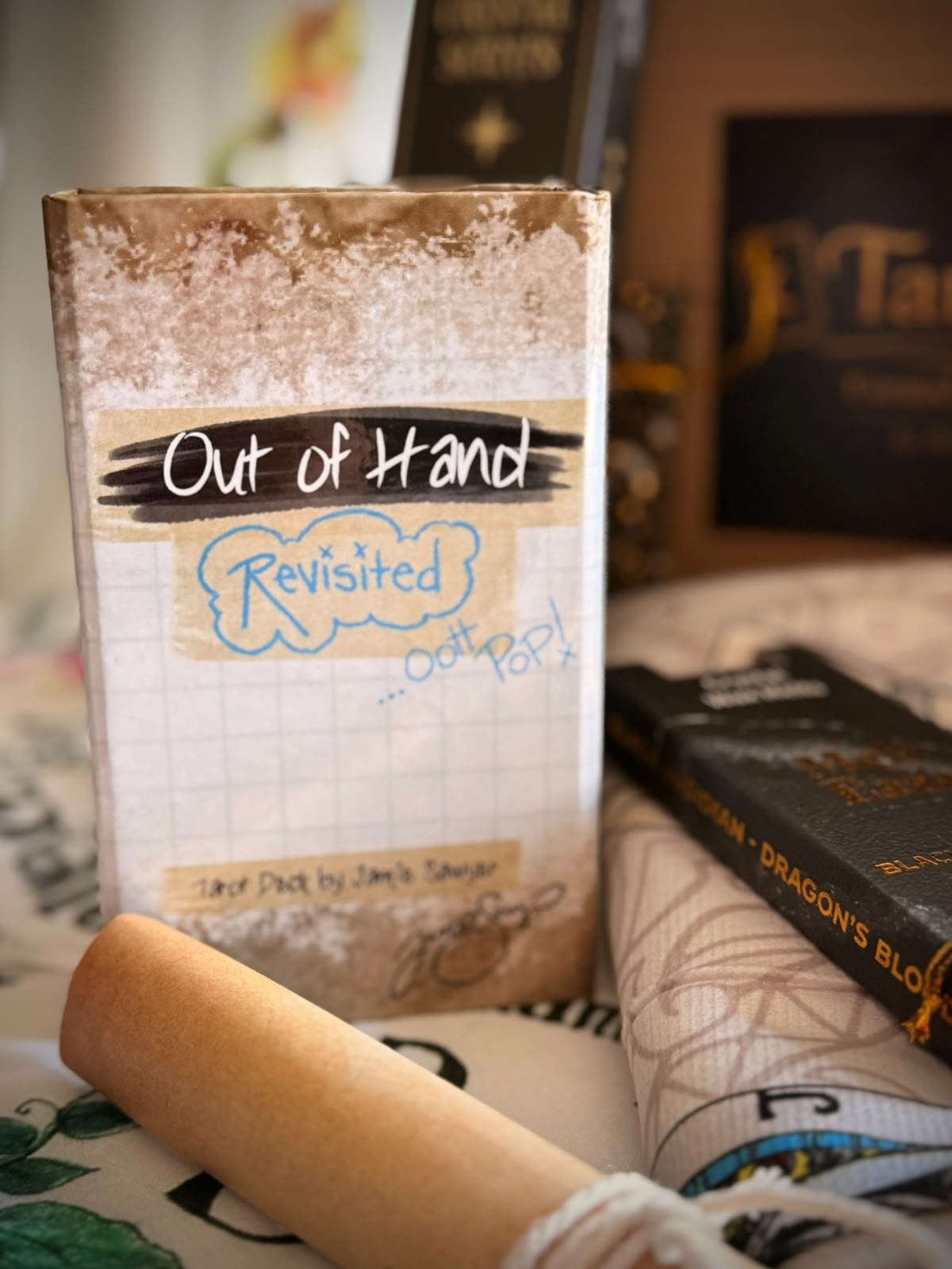 Out of Hand Revisited Tarot special 82-card edition with alternate Fool, Wheel and World cards, The Study card, new card backs, gold-gilded edges and magnetic box.