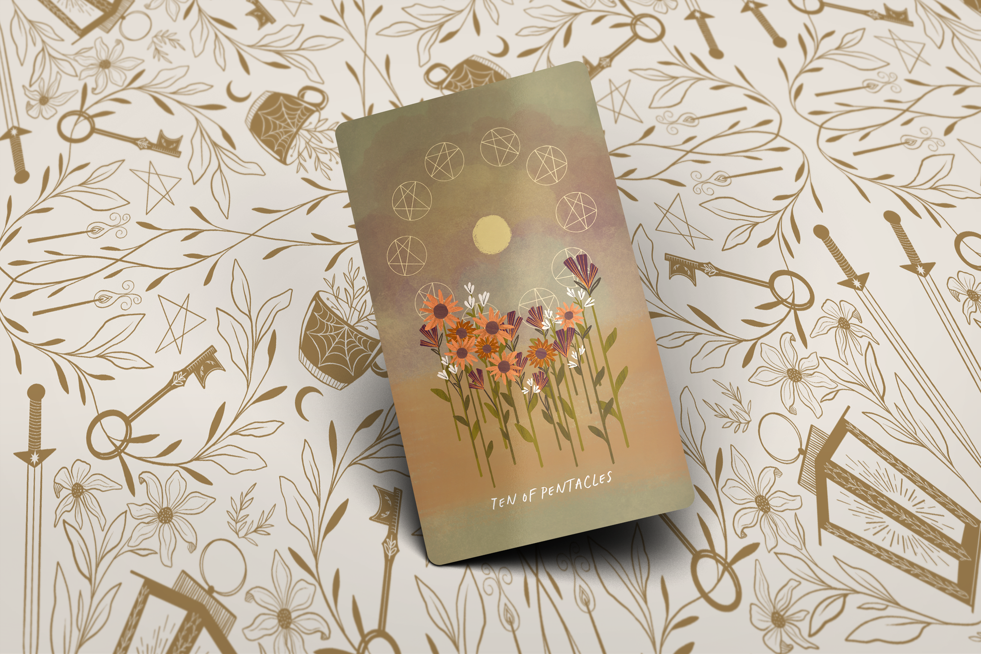 Tarot cards Ten of pentacles pip with floral design on a patterned background