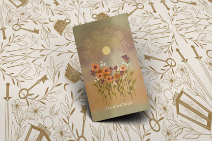 Tarot cards Ten of pentacles pip with floral design on a patterned background