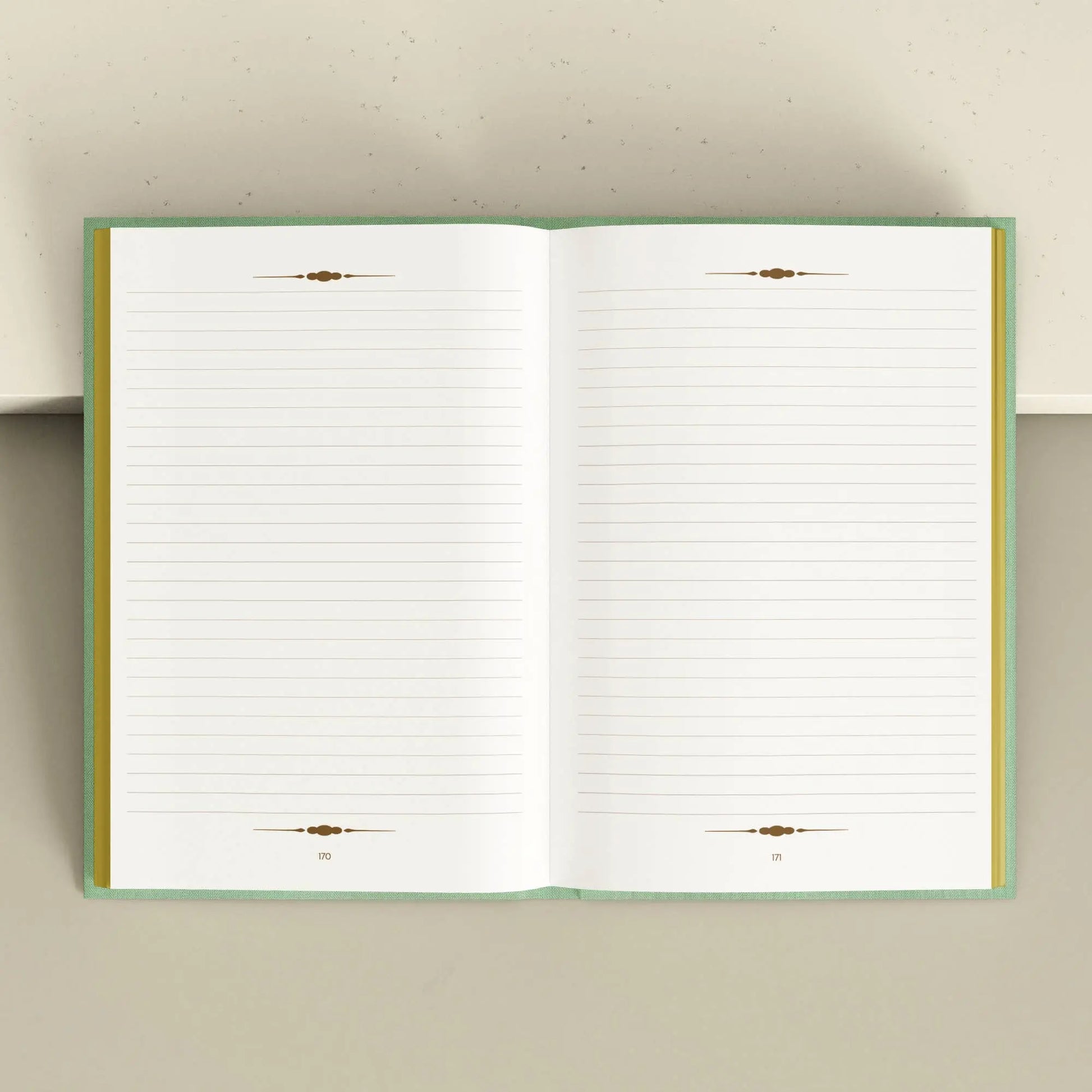 Open notebook with lined pages on a light gray background Tarot Journal Bouchette and Co Oneness Emporium