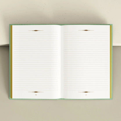 Open notebook with lined pages on a light gray background Tarot Journal Bouchette and Co Oneness Emporium
