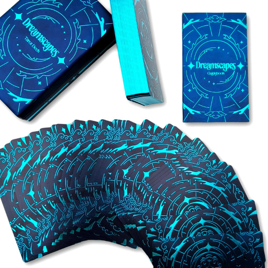 Blue and black playing cards with 'Dreamscapes' branding on packaging