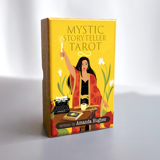 Mystic Storyteller Tarot box with illustration of a woman, typewriter, and candle on a yellow background.