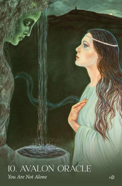 Avalon Visions Oracle deck by Cheryl Yambrach Rose featuring Celtic mystical artwork inspired by Avalon and Arthurian legend. Illustration of a woman looking at a face in a stone, with text '10. Avalon Oracle You Are Not Alone'.