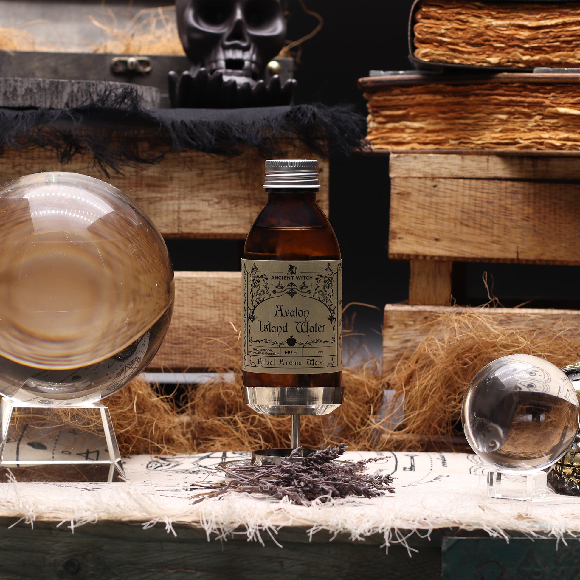 Bottle of Avalon Island Water with a glass on a rustic wooden surface.