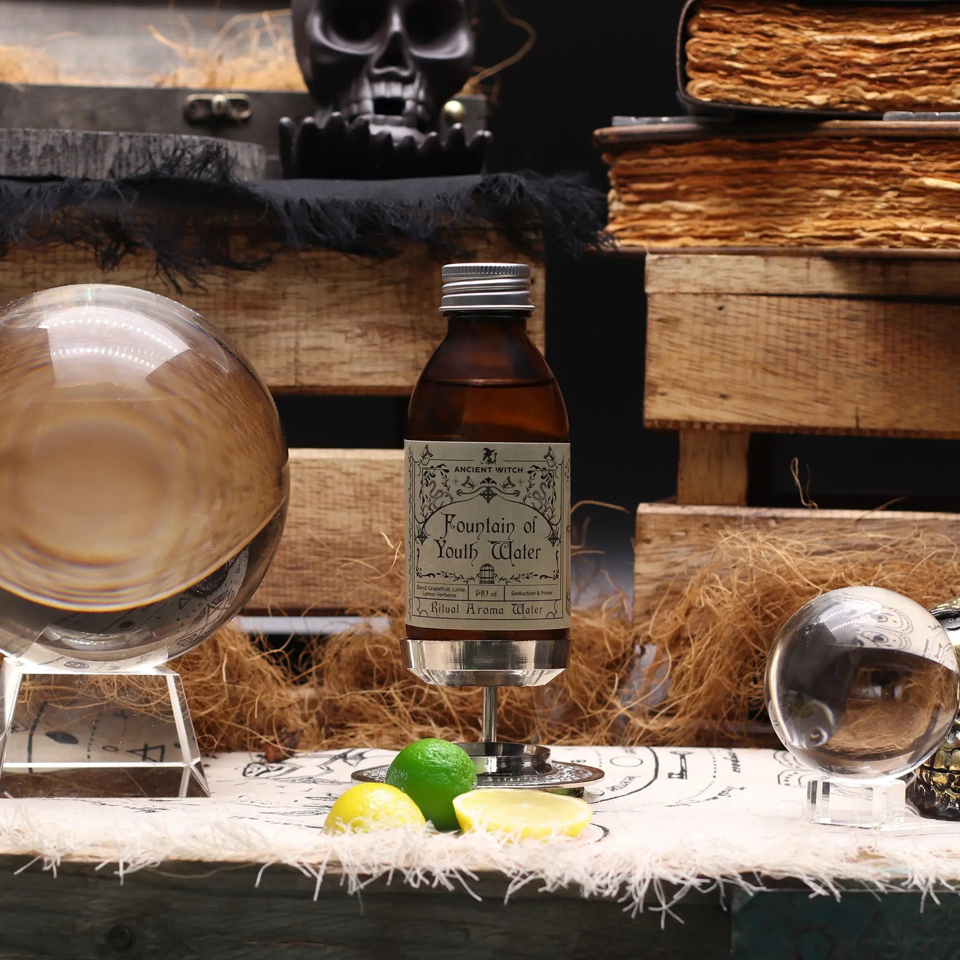 Bottle labeled 'Fountain of Youth Water' with a skull and books in the background