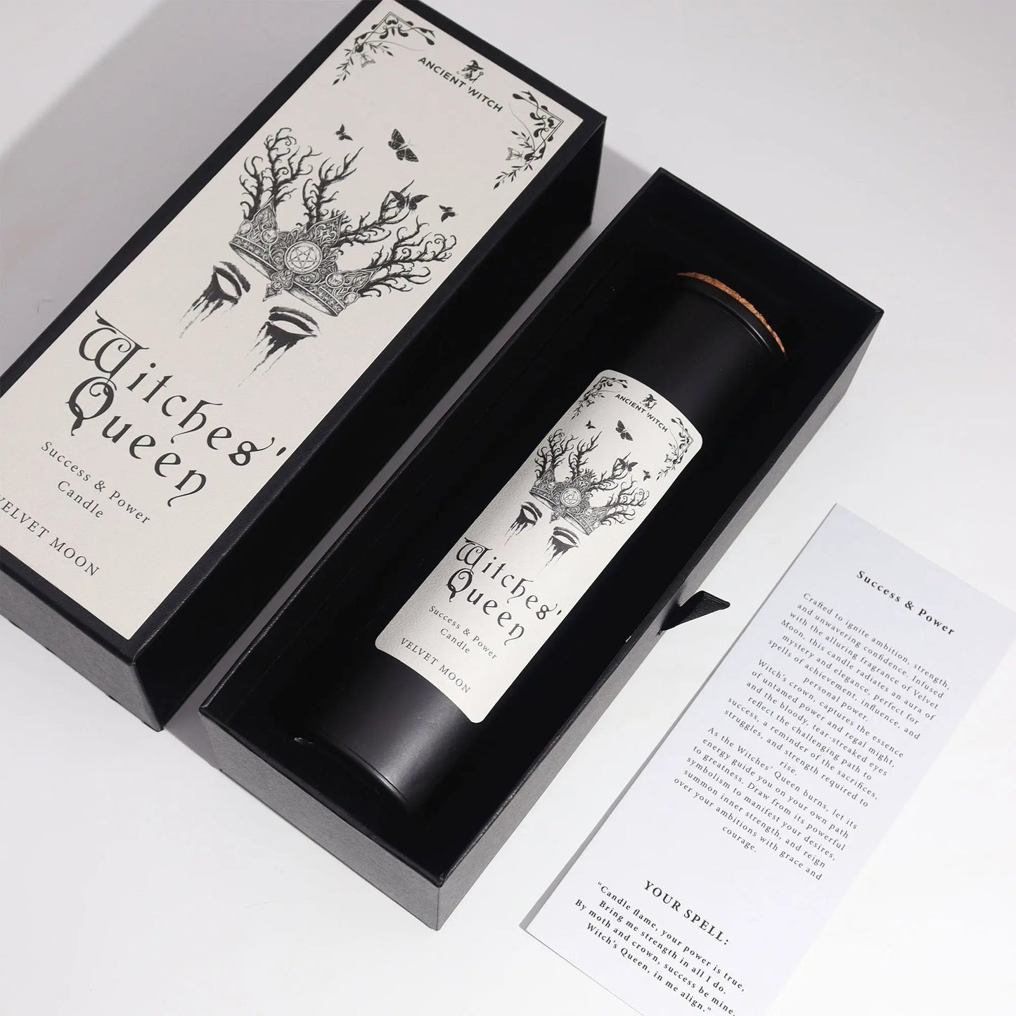 Candle labeled 'Witches' Queen' in a black box with decorative design on a white background