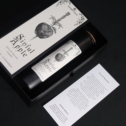 Sinned Apple candle in packaging with label and information sheet on a black background