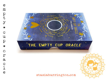 The Empty Cup Oracle by Stasia Burrington featuring minimalist black ink illustrations, gold-edged cards, and a foil-stamped collector's box.