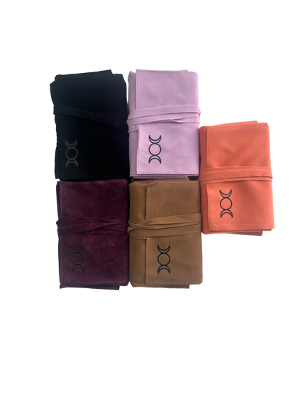 Five tarot pouch wraps in black, purple, pink, brown, and orange on a white background.