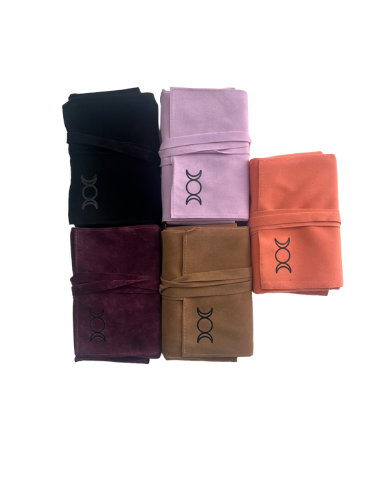Five tarot pouch wraps in black, purple, pink, brown, and orange on a white background.