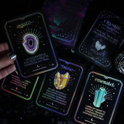 Set of tarot cards with glowing effects on a dark background