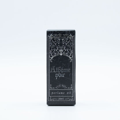 Black box of 'Athome Noir' perfume oil on a white background